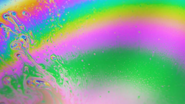 Bubbles Swirling in Rainbow Liquid Colors. Dreamy Hypnotic Abstract Background