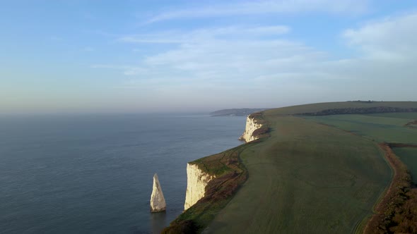 Green plains on Old Harry Rocks cliffs, county Dorset in England. Aerial panoramic view