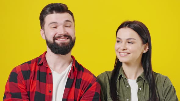 Smiling Young Couple Two Friends Guy Girl in Casual Shirts Posing Isolated on Yellow Background