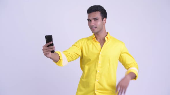 Happy Young Indian Businessman Taking Selfie