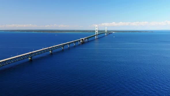 Drone view of the Mackinac Bridge and blue waters of the Great Lakes in the summer in Michigan