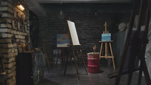 An Art Studio with a Blank Canvas in the Middle