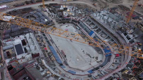 Construction Site of Unfinished Sports Stadium with Machines