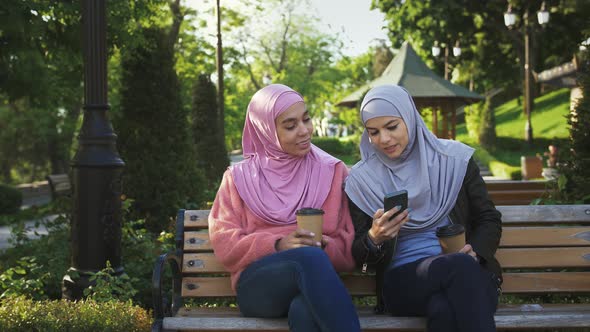 Two Muslim Females in Casual Clothes and Hijabs