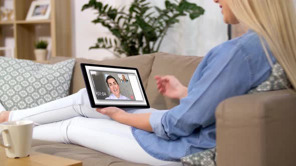 Woman Having Video Call on Tablet Computer at Home 125