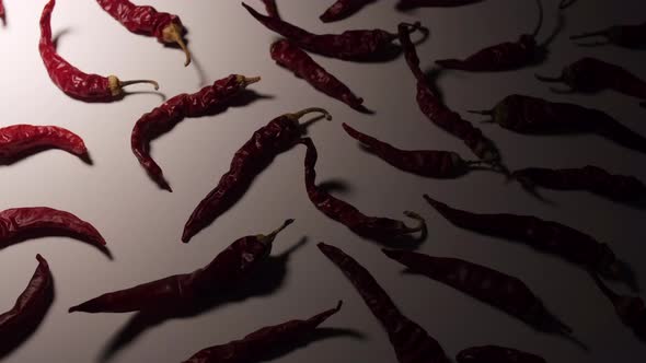 Chili peppers illuminated on white background.