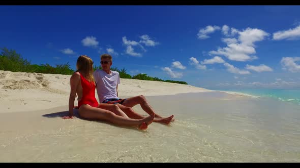 Man and lady tan on tranquil resort beach journey by blue ocean and bright sand background of the Ma