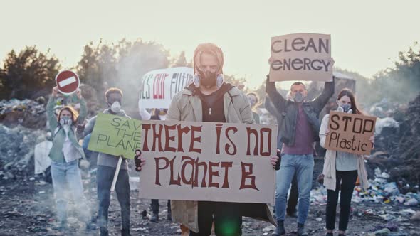 Portrait of Young Man and Woman Activist With a Poster Calling for the Care of the Environment.