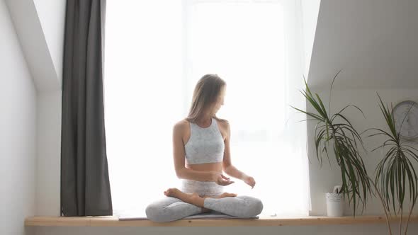 Woman Doing Yoga and Listening To the Music at Home