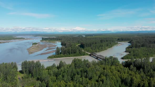 4K Drone Video of Alaska Railroad Train Trestle Bridge with Mt. Denali in Distance near Talkeetna, A