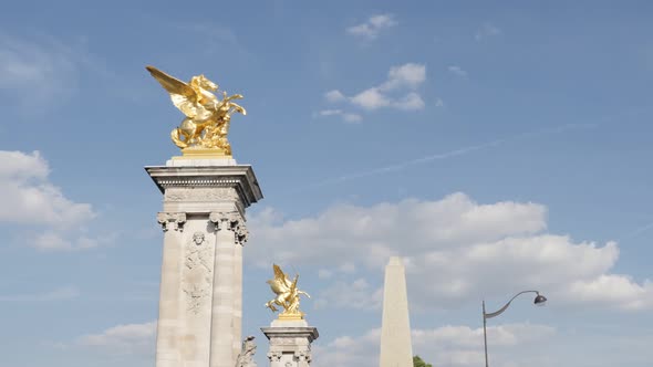 Sculptures against blue sky in French capital of Paris 4K 2160p 30fps UltraHD footage - Famous Pont 