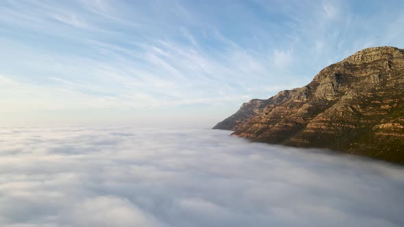 Aerial view of False bay covered in low cloud sunrise, Simonstown, Cape Town, South Africa.