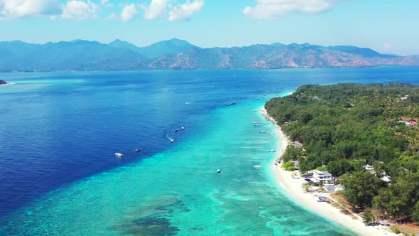 Aerial view scenery of idyllic bay beach adventure by transparent water with white sandy background 