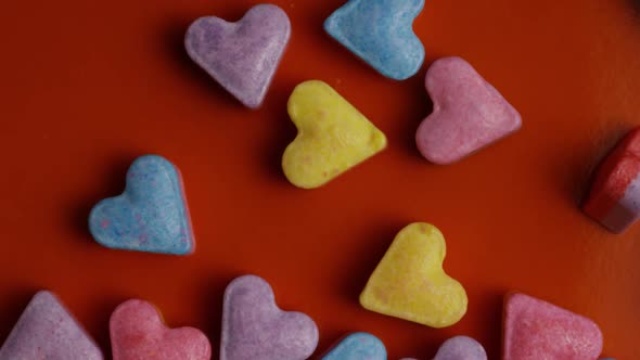 Rotating stock footage shot of Valentines decorations and candies - VALENTINES 0089