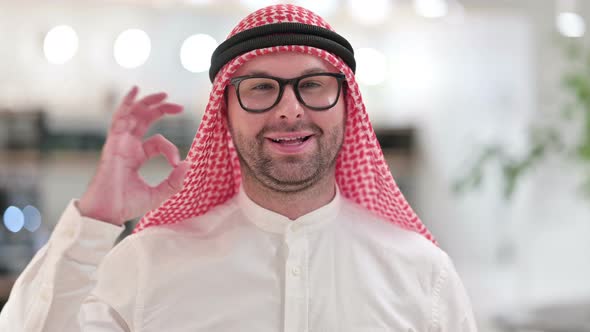 Attractive Young Arab Businessman Showing Ok Sign with Hand