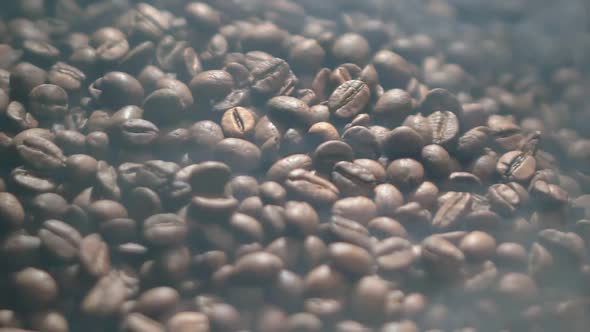 Closeup of Brown Roasted and Fragrant Coffee Beans with an Aromatic Smoke