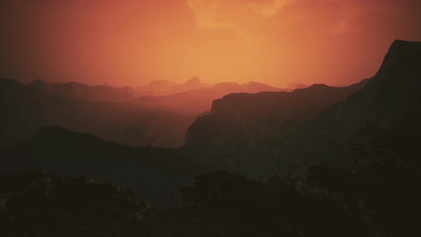 Dramatic Sky Over Rocky Mountains at Sunset