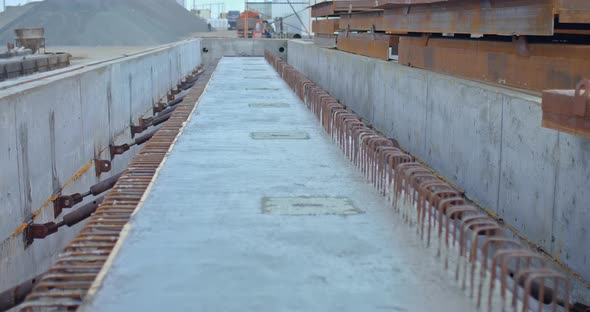 Construction Site a Long Concrete Beam Lies in the Form