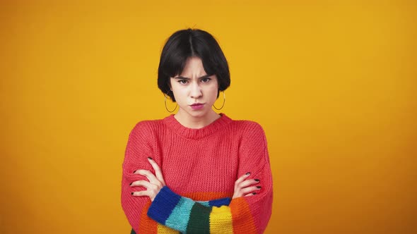 Young Grumpy Lady Crossing Hands Feeling Offended and Unhappy Orange Background