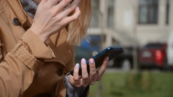 Girl Typing a Message on Her Smartphone