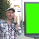 A Middle-aged Man Is Standing on a City Street Next To a Billboard - VideoHive Item for Sale