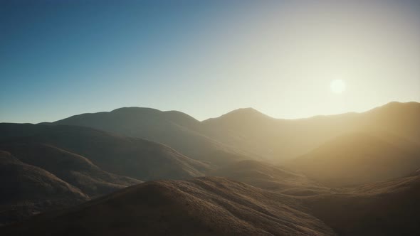 Hills with Rocks at Sunset