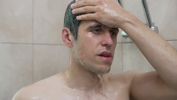 Young Man Taking a Shower