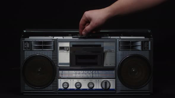 The Hand Opens the Lid of the Tape Recorder and Takes Out the Cassette Closeup