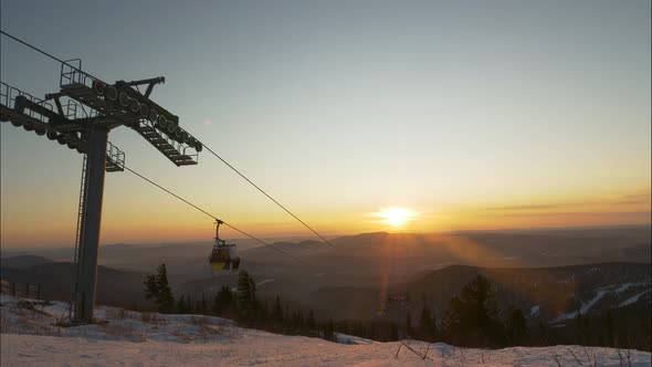 Silhouette of Ski Lift on Mountain Hill at Resort at Sunset