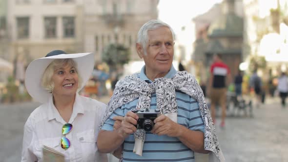 Senior Two Tourists Walking in Town Center. Traveling in Lviv, Ukraine