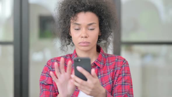 African Woman Using Smartphone Browsing Internet