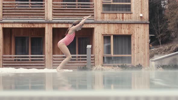 Girl diving into swimming pool