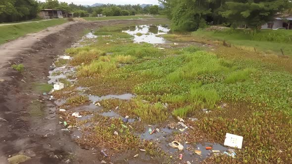 River fill with rubbish.