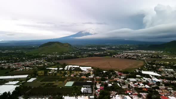 View of Popocatepetl vulcano full of snow in august