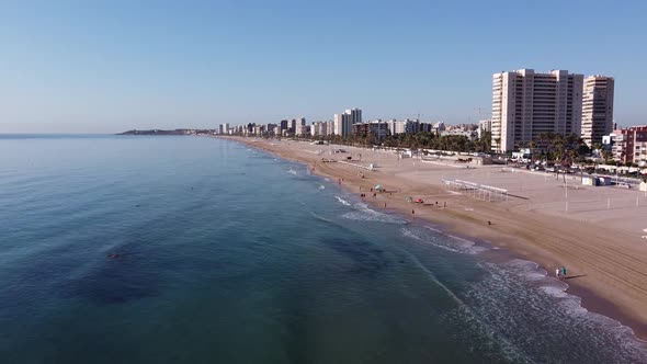 Flying along the San Juan Beach, in Alicante, Spain. Early in the morning.