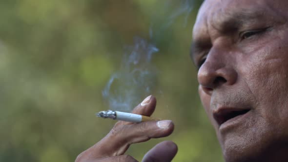 Asian Indian Man Smoking A Cigarette In SloMo
