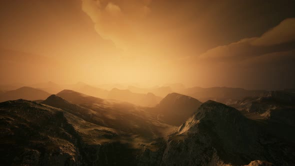 High Mountain Peaks Covered with Dramatic Heavy Fog alt