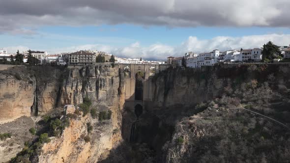 Aerial hyperlapse: Activity at famous medieval stone bridge in Ronda