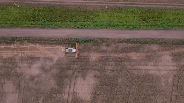 Top View of a Harvester That Harvests in a Grain Field