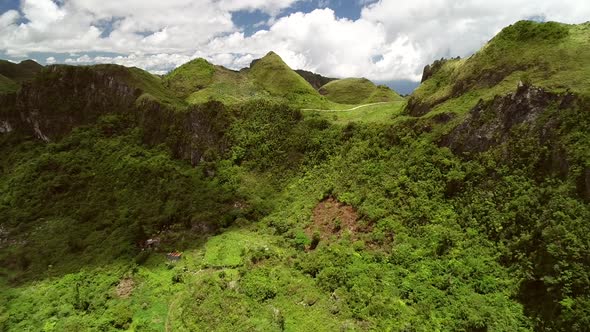 Aerial view of Chocolate hills and cloudy sky in Badian, Philippines.