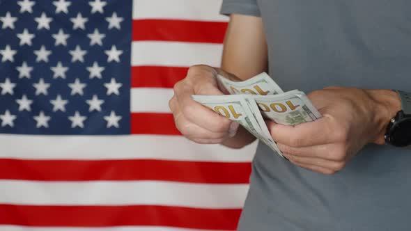 Counting Money Against American Flag