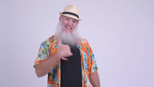 Happy Mature Bearded Tourist Man Giving Thumbs Up