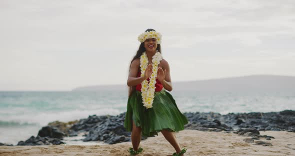 Woman performing Hawaiian hula on the beach