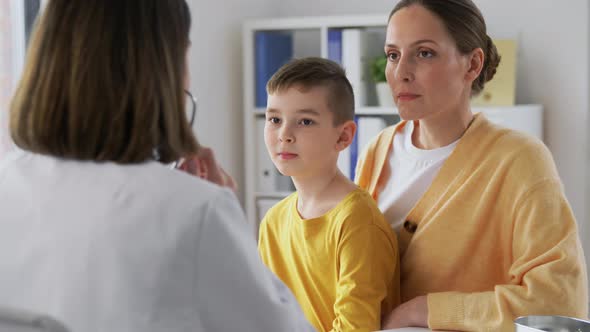 Mother Son and Doctor with Stethoscope at Clinic