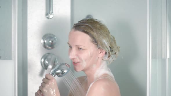 Woman Washes Hair and Singing