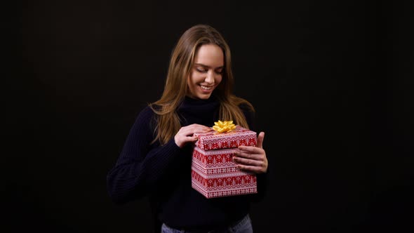 A girl opening a present