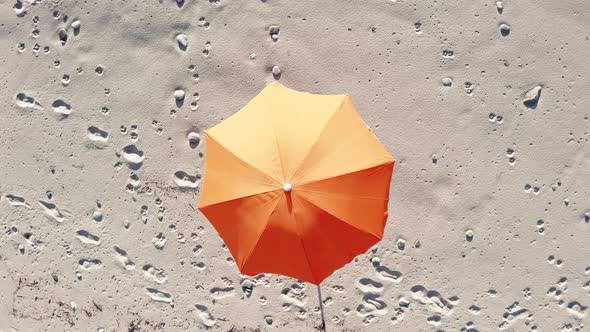 Beach Umbrella on White Sand