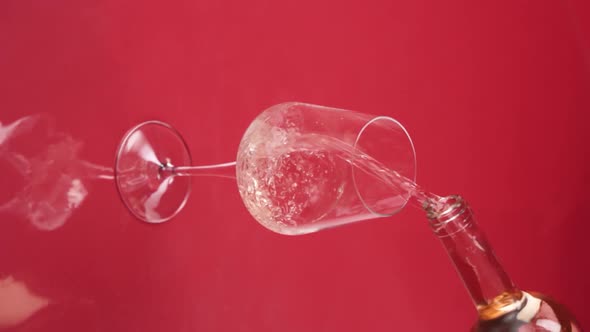 Vertical video, Close-up: red wine is poured into a glass