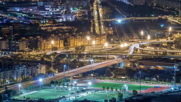 Barcelona and Badalona Skyline with Roofs of Houses and Sea on the Horizon Night Timelapse