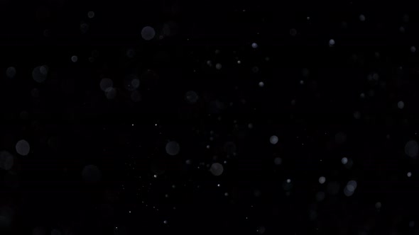 Super Slow Motion Shot of Silver Glittering Particles Isolated on Black Background at 1000 Fps